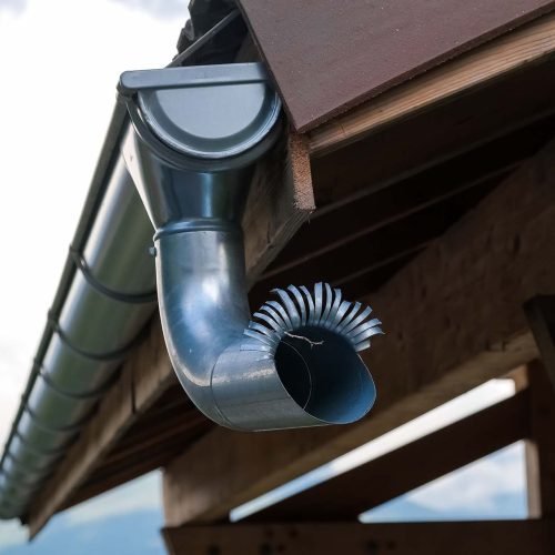External pipes to drain the water from heavy rains on the roofs of mountain houses.
