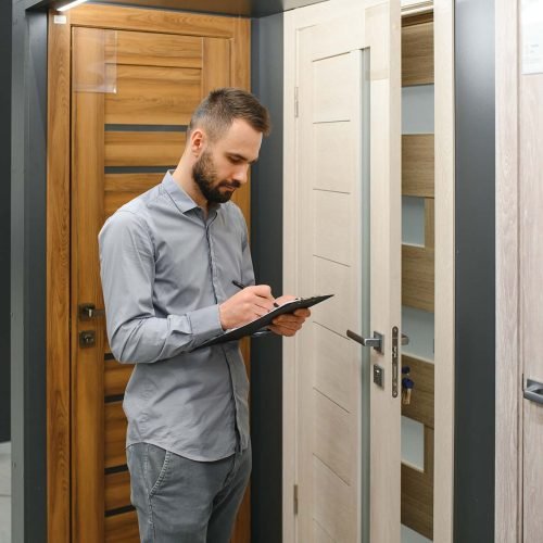 sales consultant standing near the interior door.